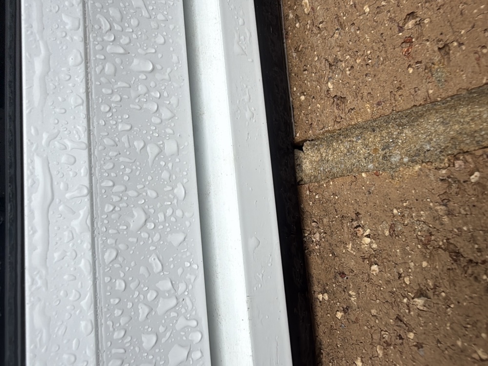 Gaps in the brick mortar under the window sills, letting water into the cavity, found during a pre-handover inspection in Clyde
